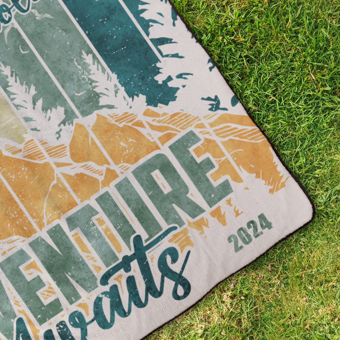 Adventure_Awaits_2_StadiumBlanket_OverheadGrass_H_Mockup.png
