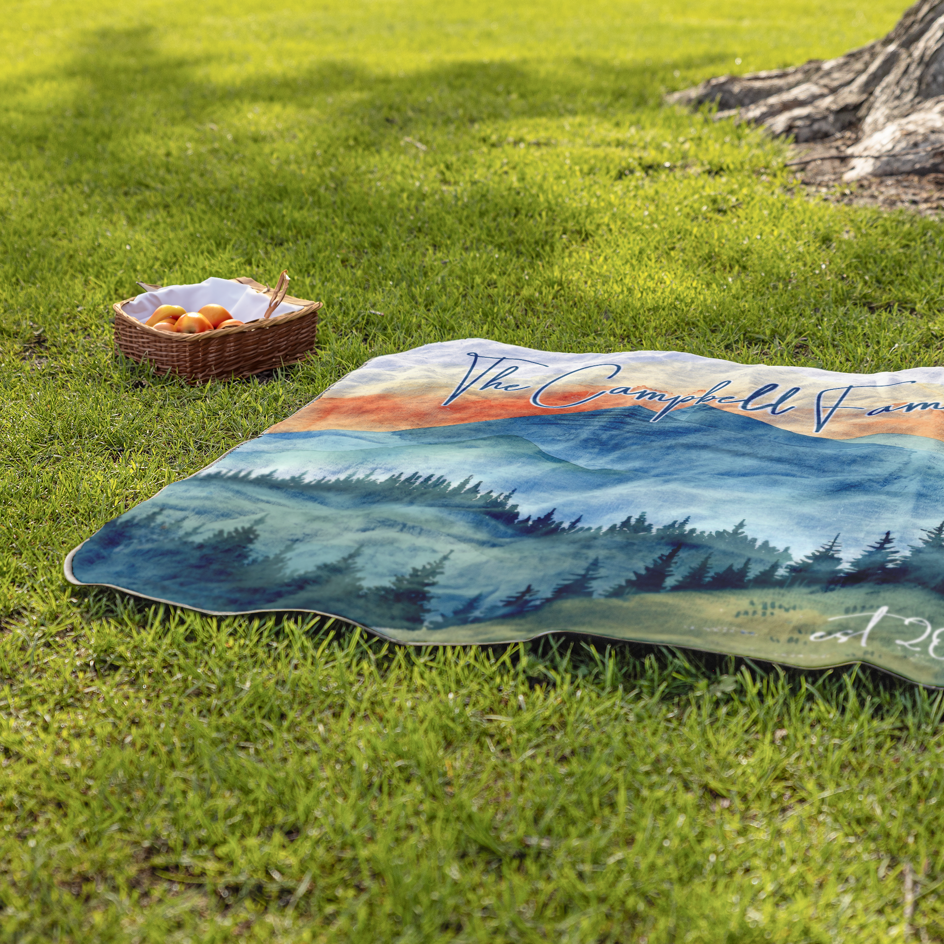 Sunset_Mountain_Blanket_StadiumBlanket_Lifestyle_Grass_H_Mockup.png