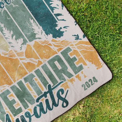 Adventure_Awaits_2_StadiumBlanket_OverheadGrass_H_Mockup.png